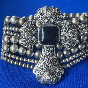 Silver and Black Ornate Brooch with Intricate Filigree